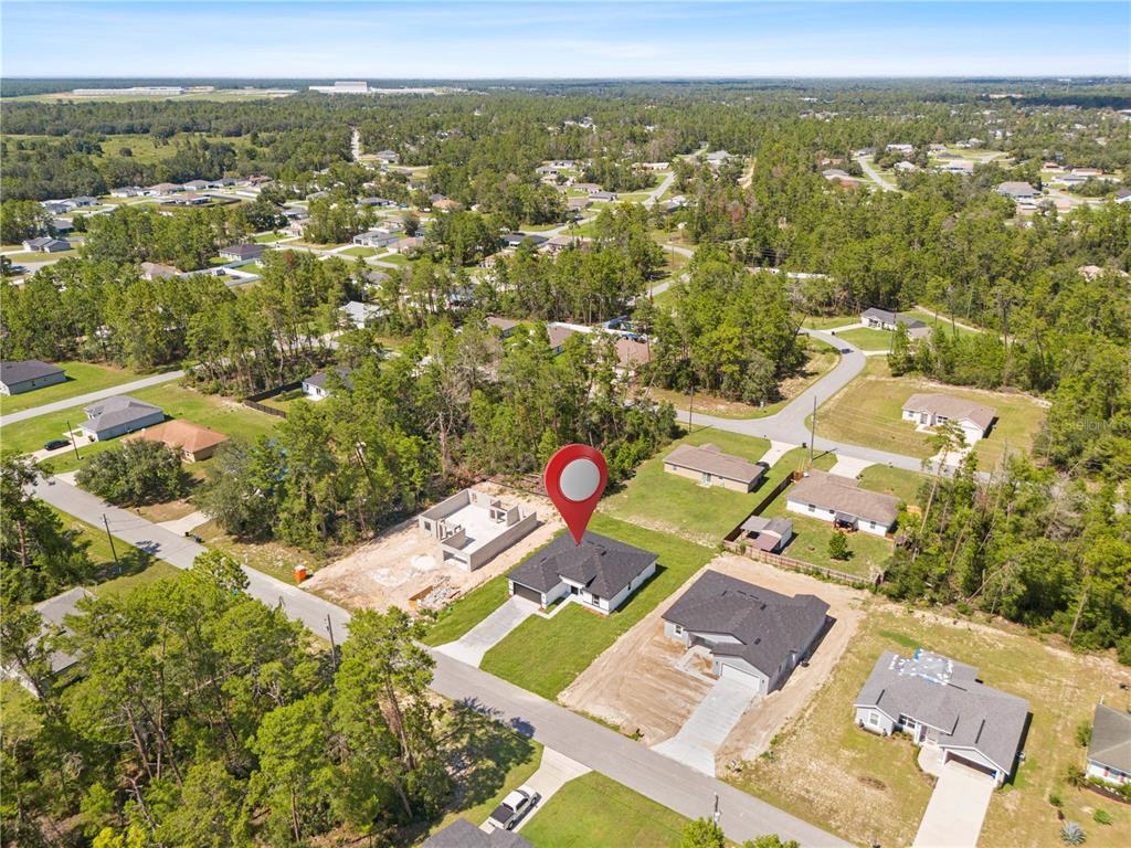 5217 Southwest 165th St Road Ocala, FL 34473 - Photo 33 of 35 an aerial view of residential houses with outdoor space