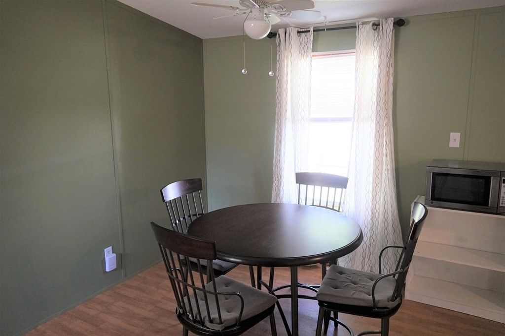 62 Cypress Road Taunton, MA 02780 - Photo 11 of 26 a view of a dining room with furniture and wooden floor