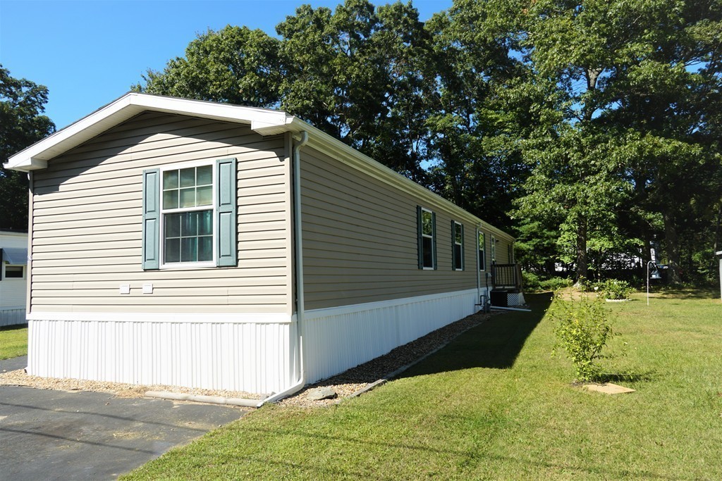 62 Cypress Road Taunton, MA 02780 - Photo 3 of 26 a front view of a house with a yard