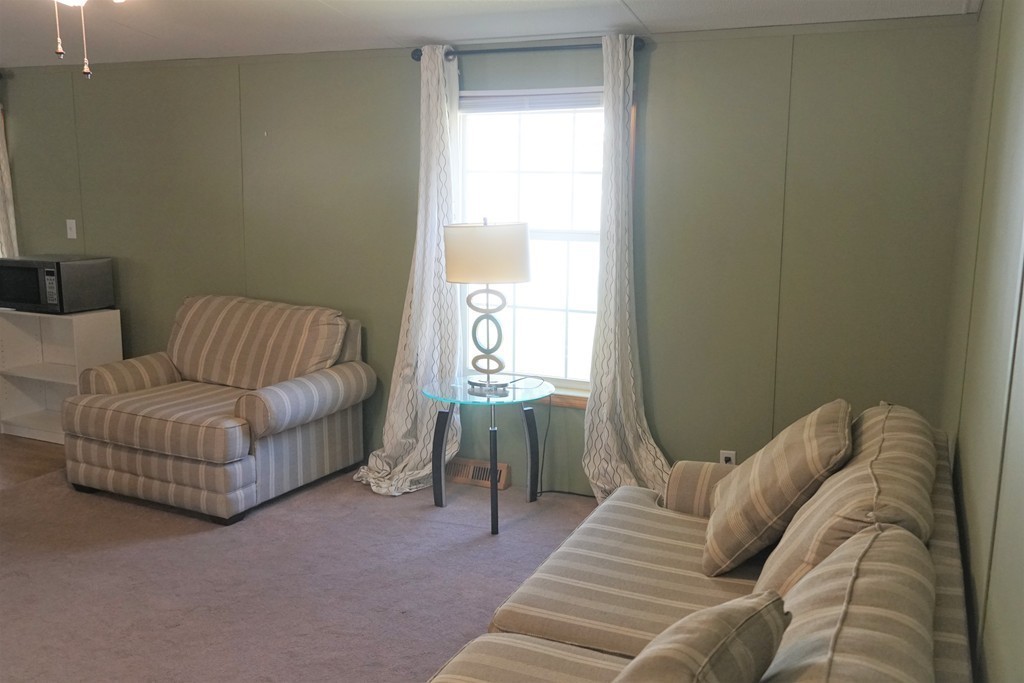 62 Cypress Road Taunton, MA 02780 - Photo 7 of 26 a living room with furniture and a large window