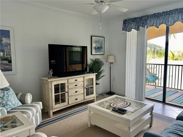 a kitchen with a potted plant on the wall and a potted plant