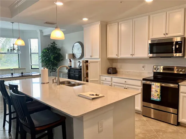 a kitchen with a table and chairs in it