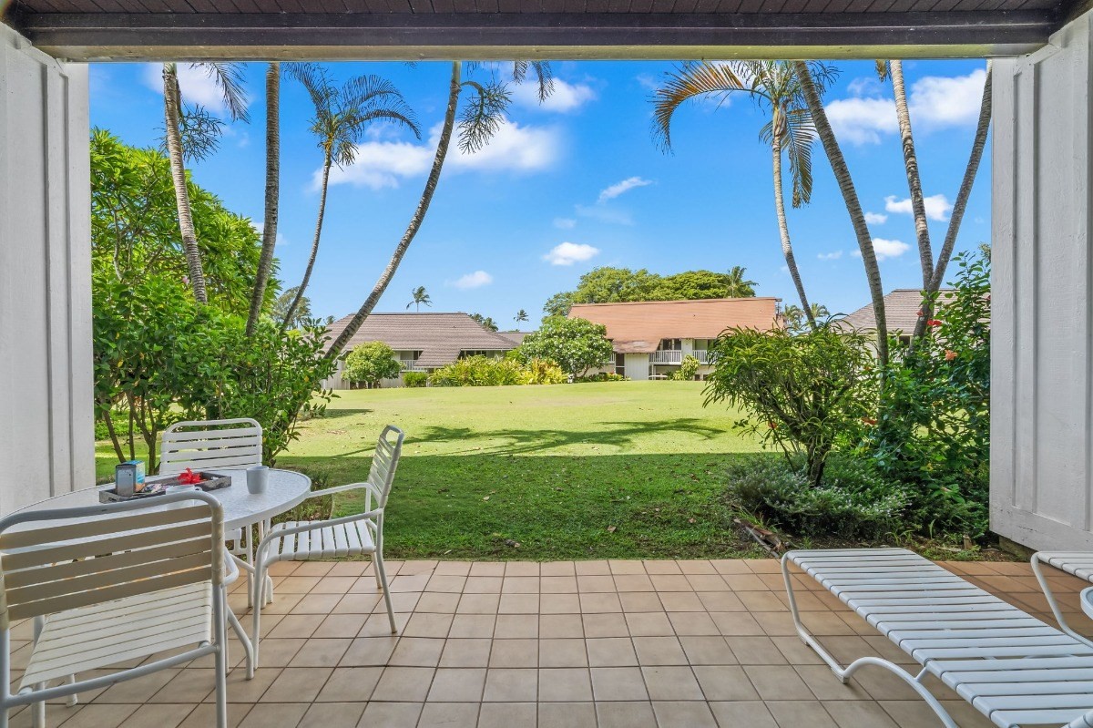 2253 Poipu Road, Unit 85 Koloa, HI 96756 - Photo 1 of 13 a view of a porch with a table and chairs
