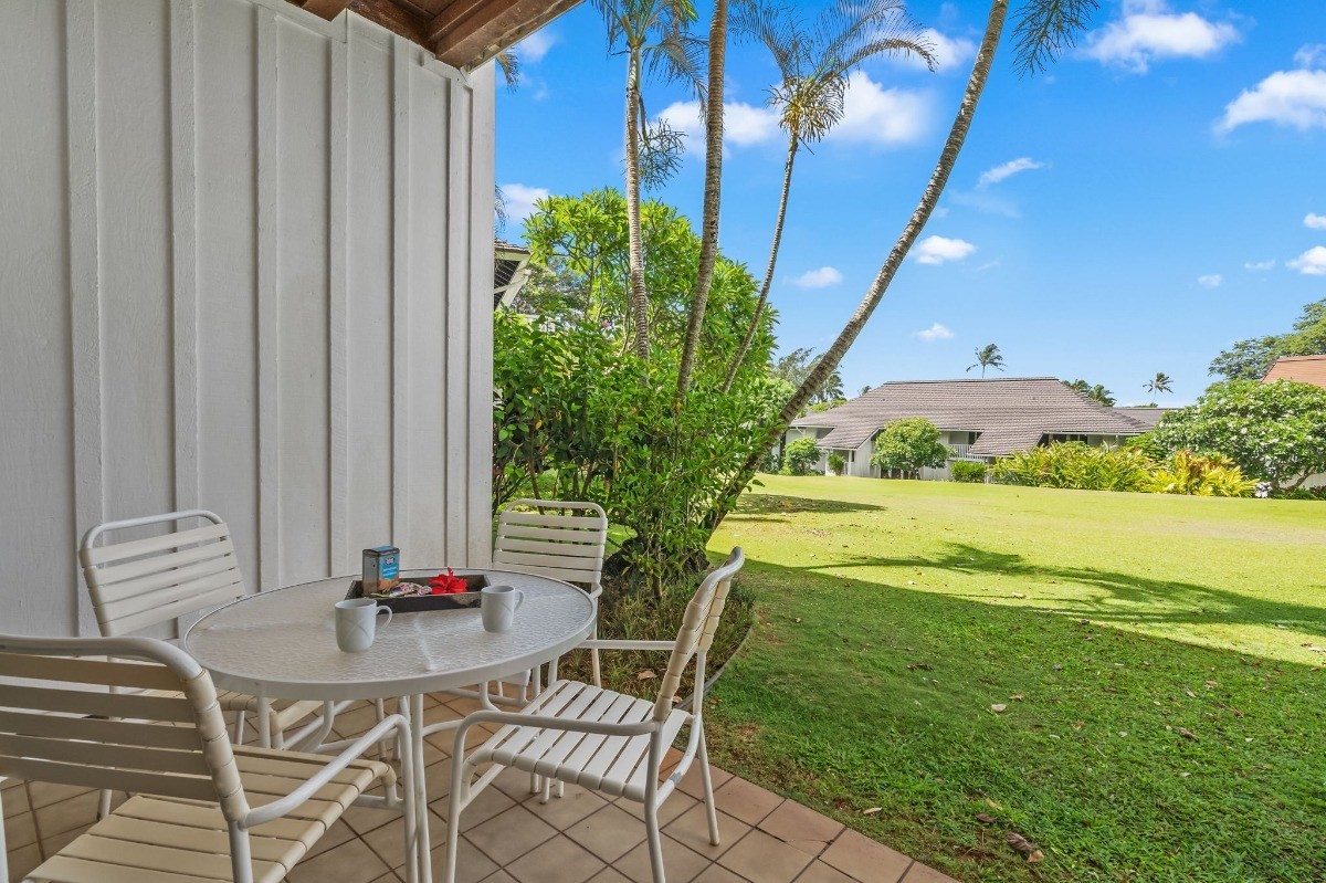 2253 Poipu Road, Unit 85 Koloa, HI 96756 - Photo 11 of 13 a view of an chairs and table in the patio