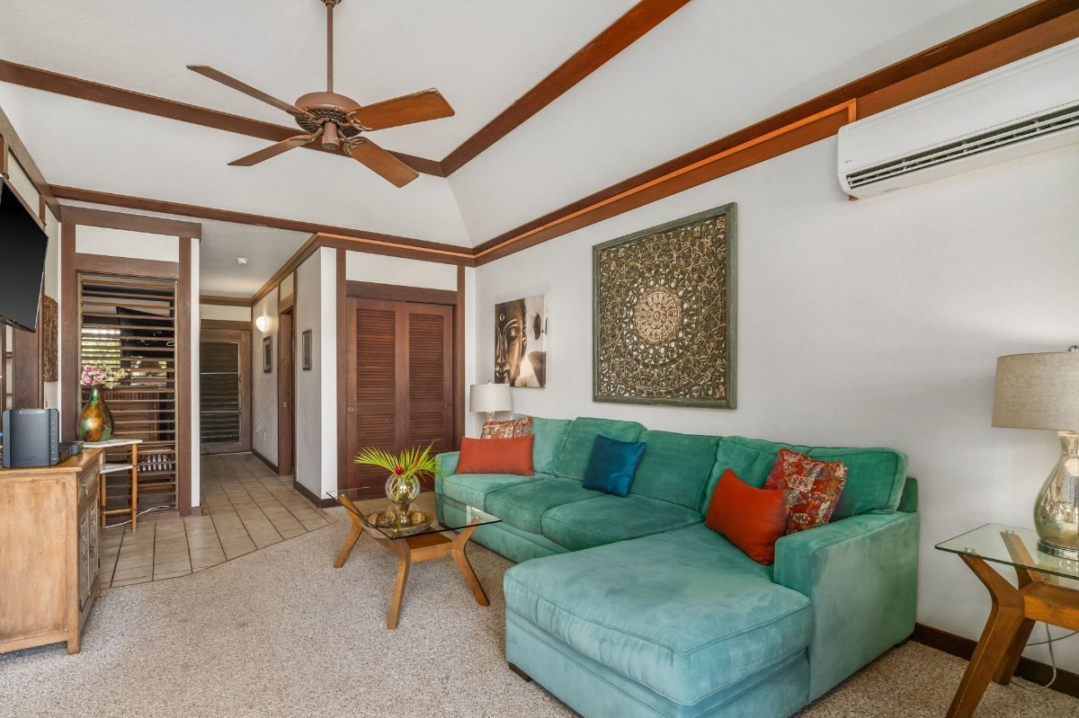 2253 Poipu Road, Unit 85 Koloa, HI 96756 - Photo 2 of 13 a living room with furniture and a ceiling fan