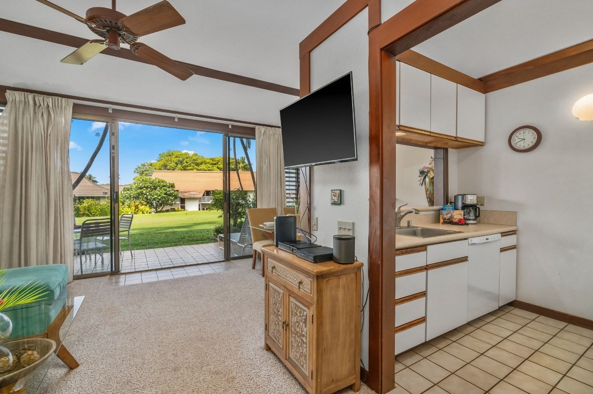 2253 Poipu Road, Unit 85 Koloa, HI 96756 - Photo 4 of 13 a kitchen with a sink and a refrigerator