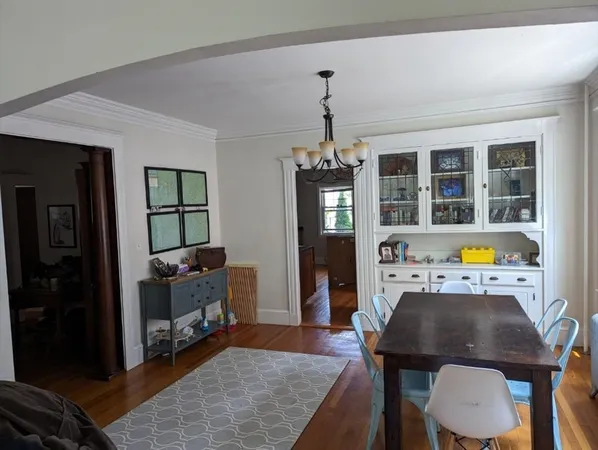 a view of a dining room with furniture and a window