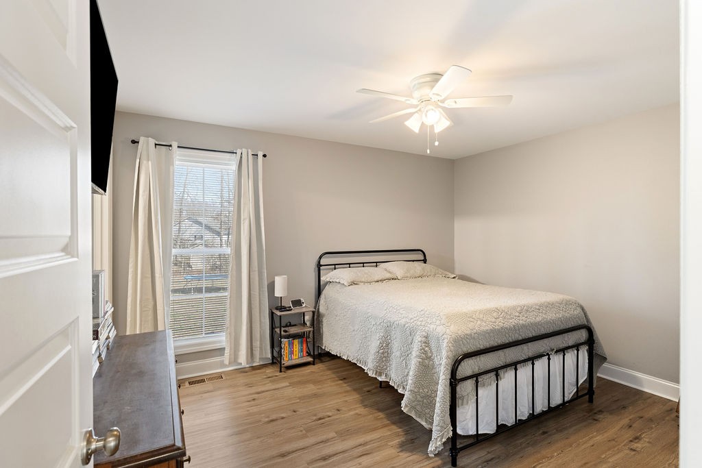 123 Timber Rdg Drive Pulaski, TN 38478 - Photo 16 of 20 a bedroom with a bed and wooden floor