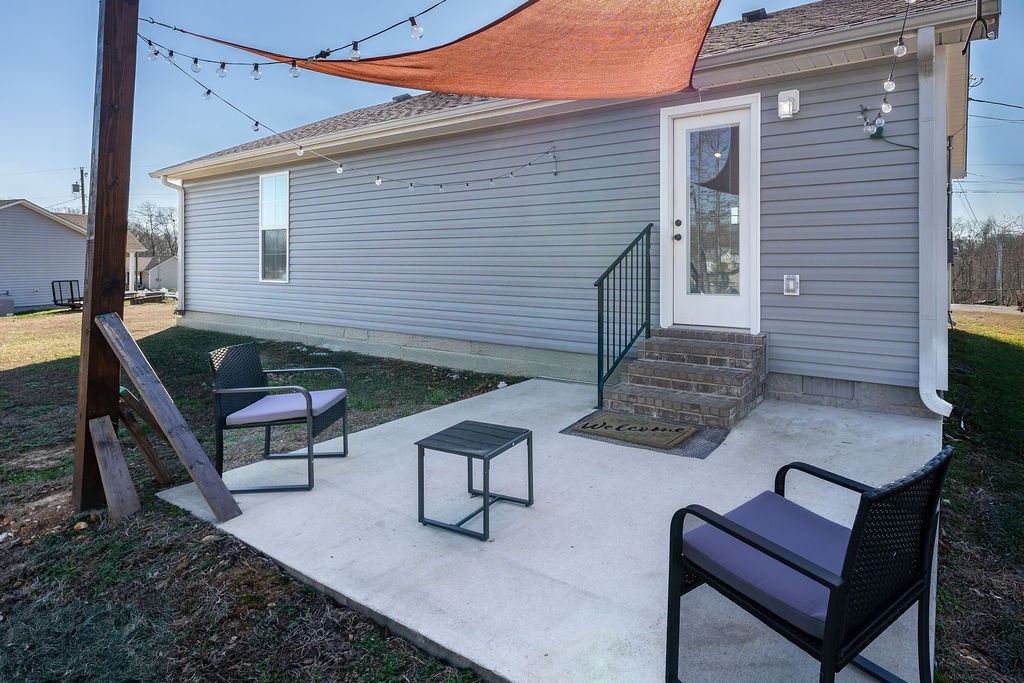 123 Timber Rdg Drive Pulaski, TN 38478 - Photo 3 of 20 a view of a chairs and table in the backyard