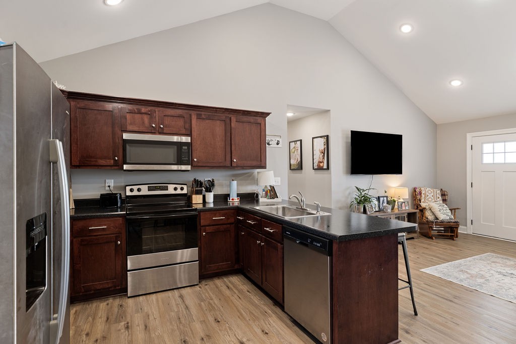 123 Timber Rdg Drive Pulaski, TN 38478 - Photo 9 of 20 a kitchen with stainless steel appliances kitchen island granite countertop a stove sink and microwave