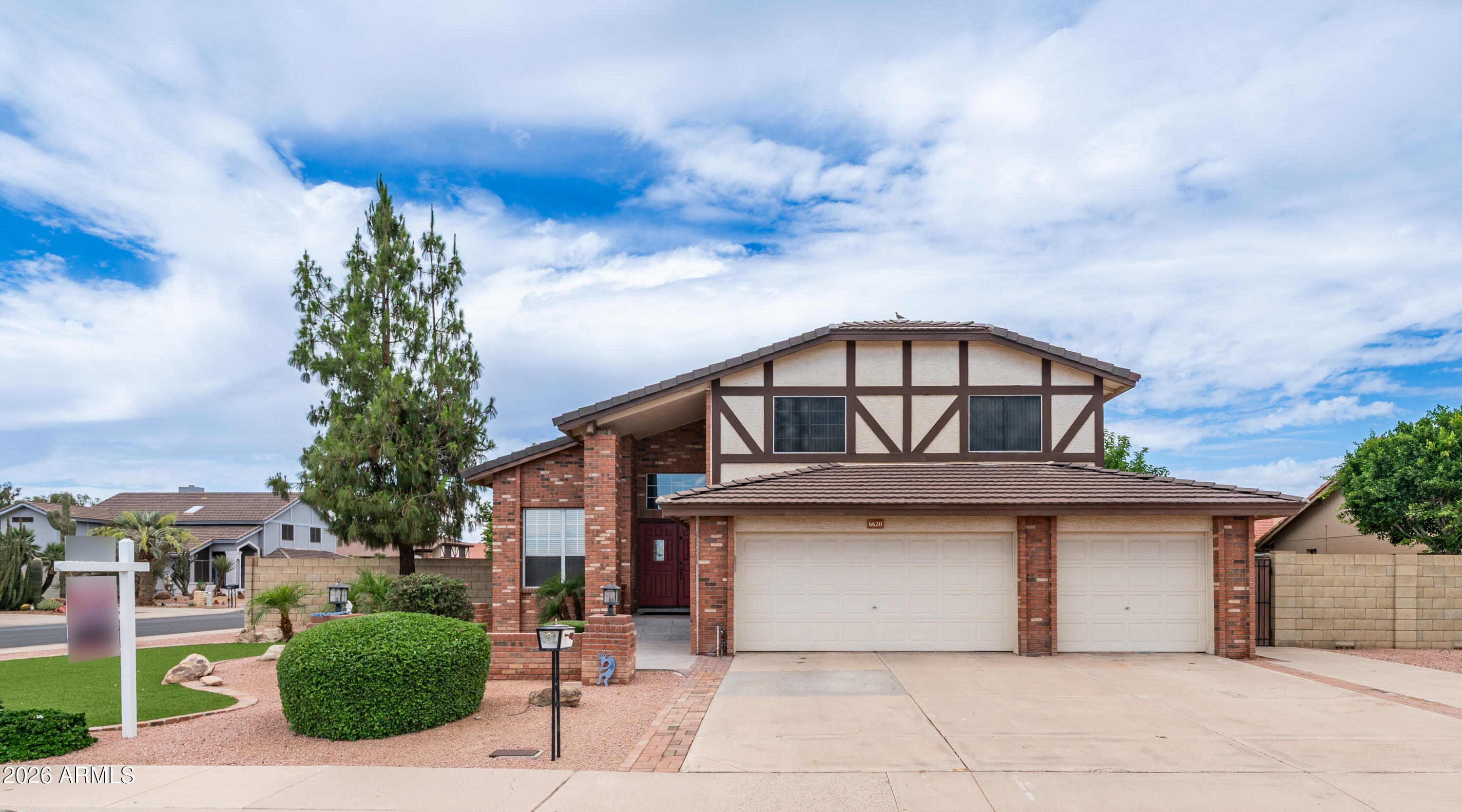 6620 West Redfield Road Glendale, AZ 85306 - Photo 33 of 33 a front view of a house with garden