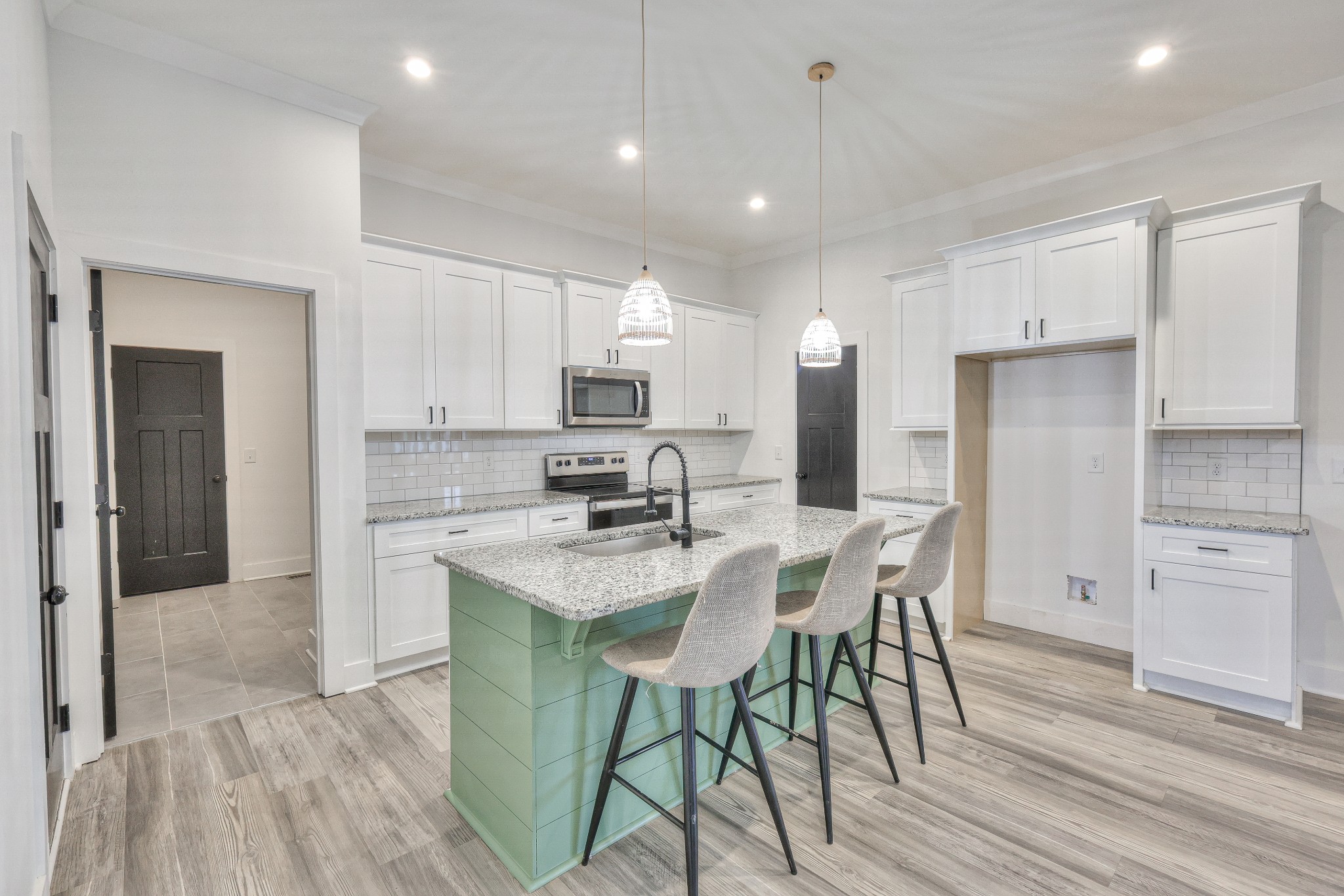 1181 Norton Road Manchester, TN 37355 - Photo 15 of 51 a kitchen with white cabinets and stainless steel appliances