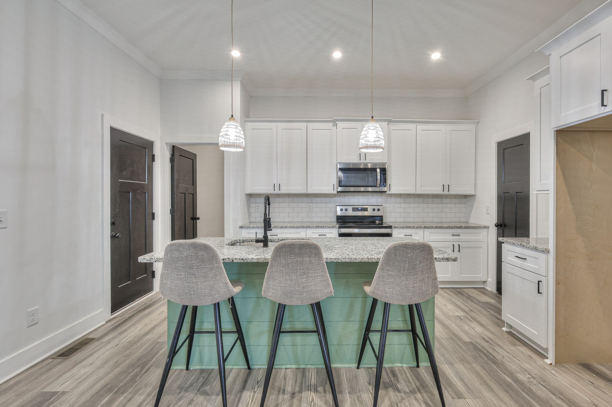 1181 Norton Road Manchester, TN 37355 - Photo 16 of 51 a kitchen with stainless steel appliances granite countertop a kitchen island a table and chairs in it