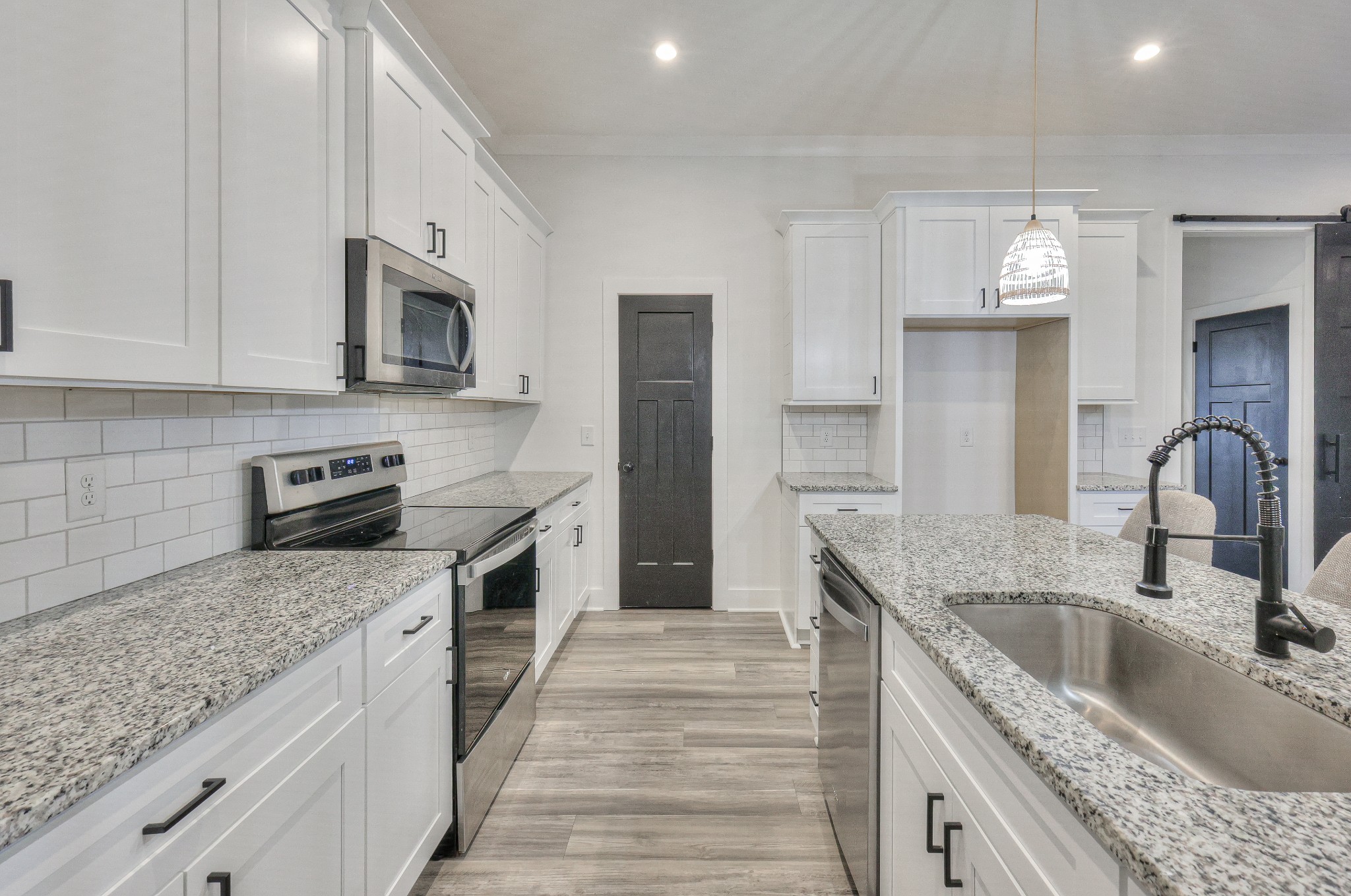 1181 Norton Road Manchester, TN 37355 - Photo 17 of 51 a kitchen with stainless steel appliances granite countertop a sink stove and cabinets