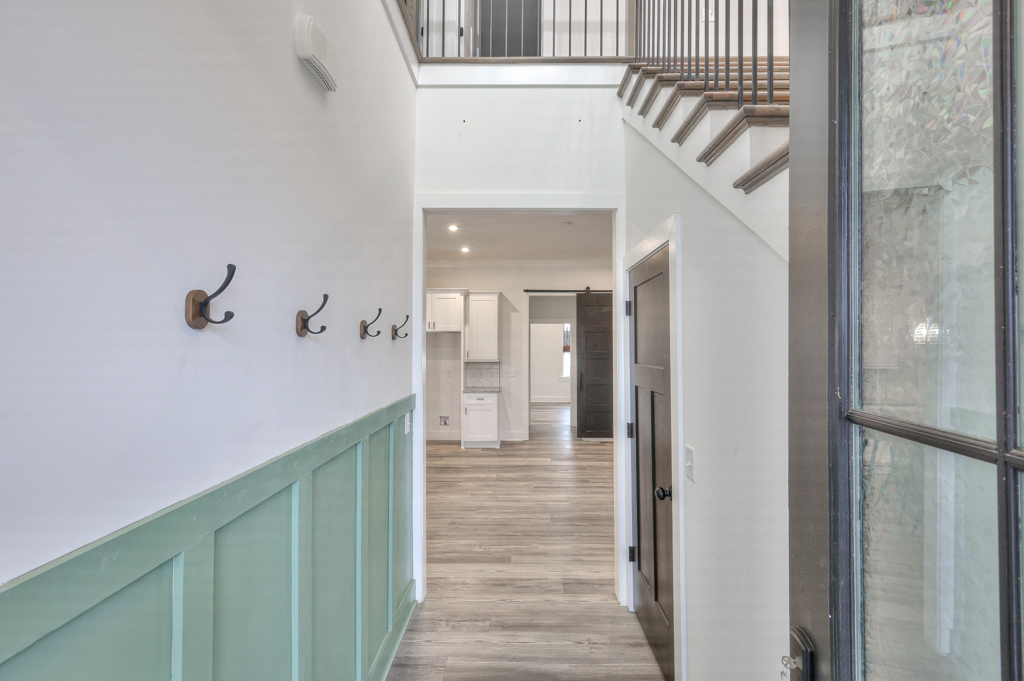 1181 Norton Road Manchester, TN 37355 - Photo 7 of 51 a view of a hallway with wooden floor and staircase