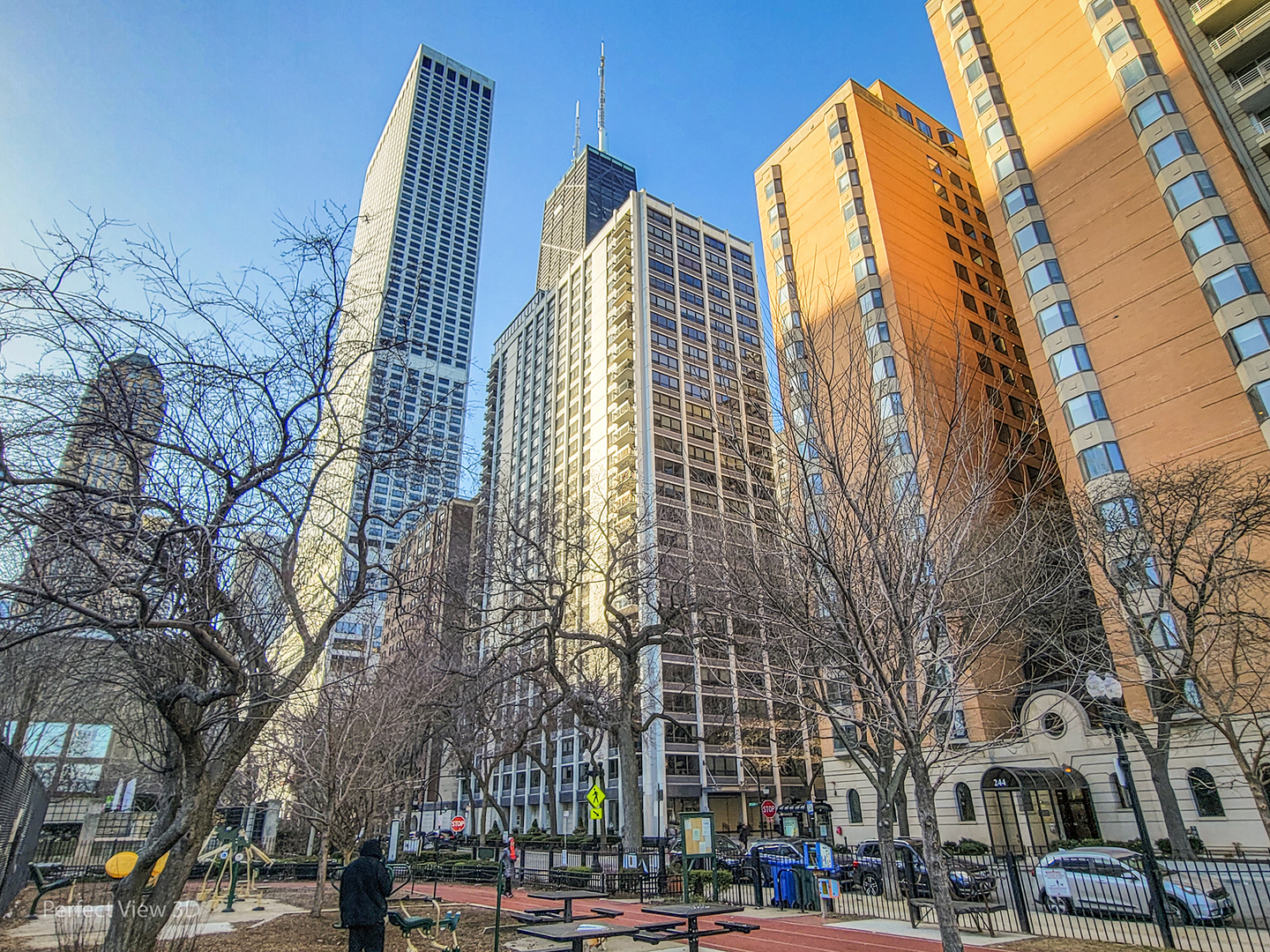 a view of buildings with a yard