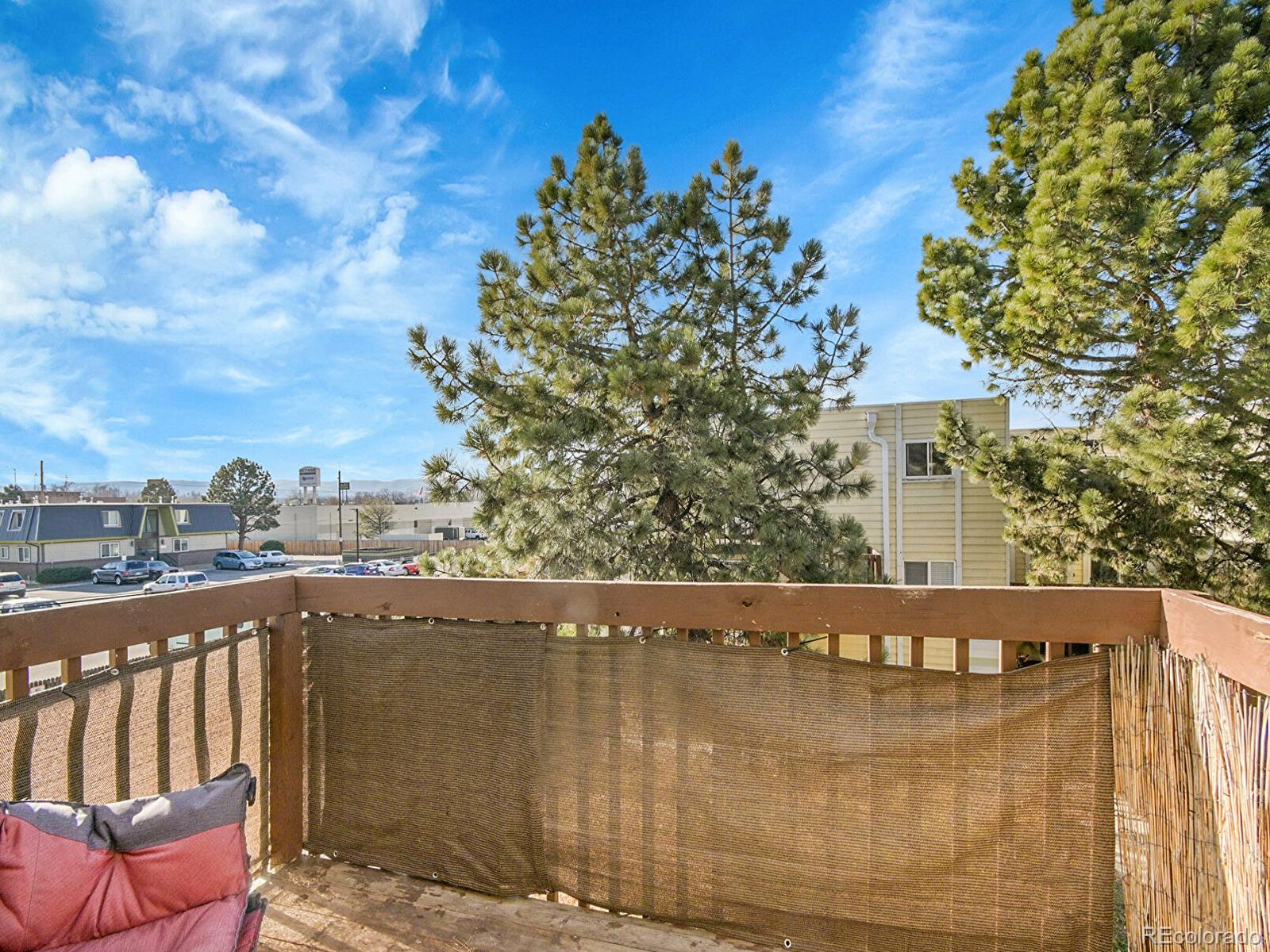 9340 West 49th Avenue, Unit 218 Wheat Ridge, CO 80033 - Photo 12 of 31 a view of a building from a balcony