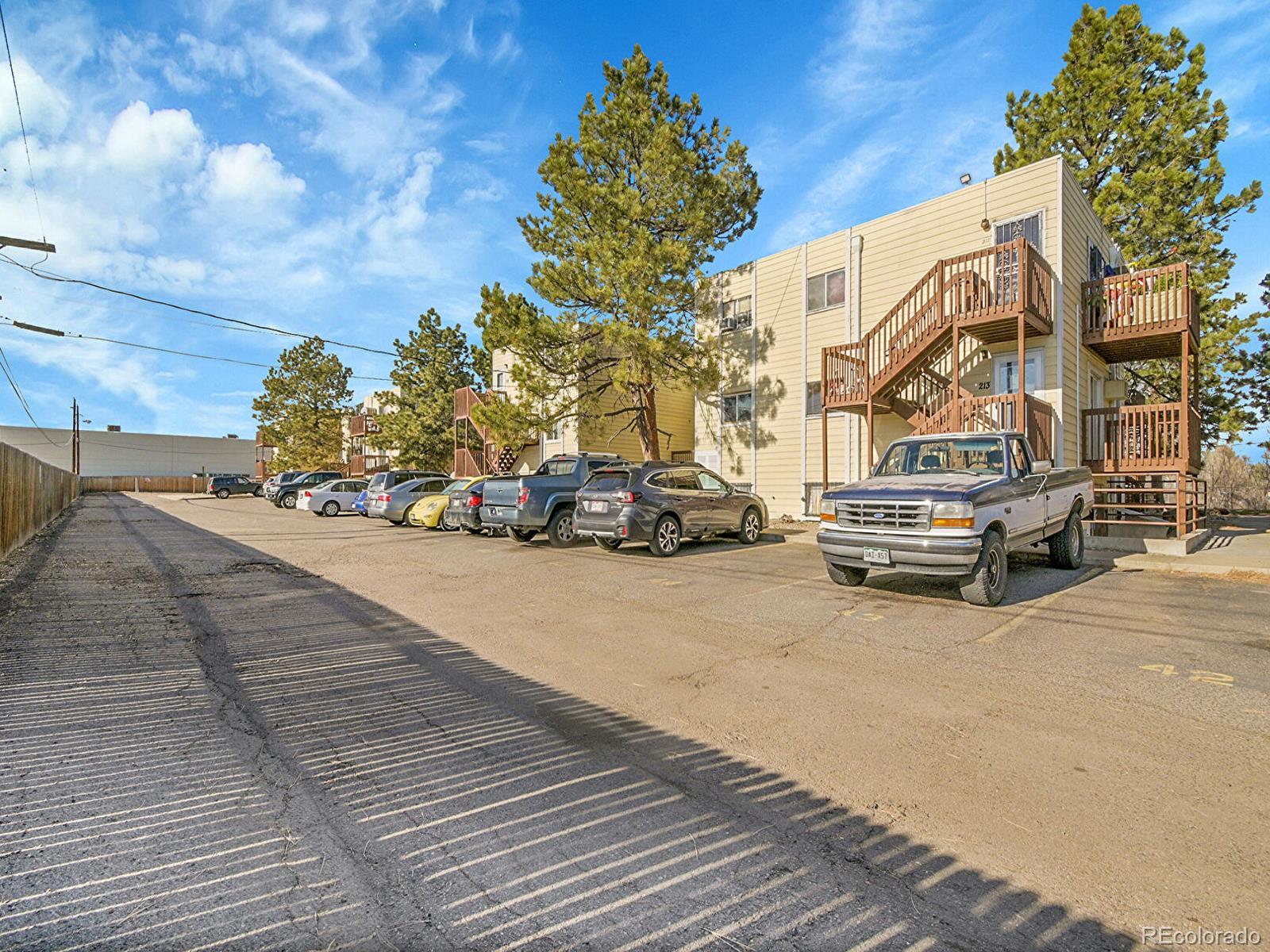 9340 West 49th Avenue, Unit 218 Wheat Ridge, CO 80033 - Photo 21 of 31 a car parked on the side of a street