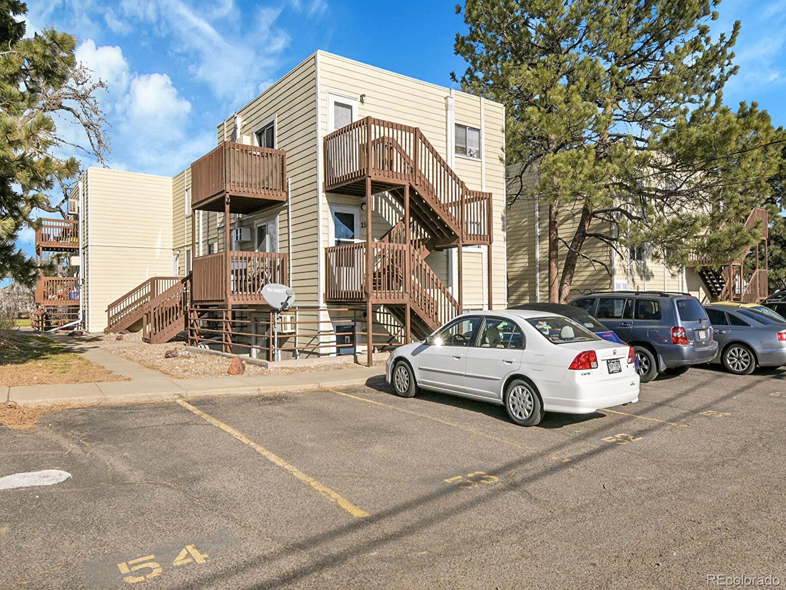 9340 West 49th Avenue, Unit 218 Wheat Ridge, CO 80033 - Photo 24 of 31 a view of a street with cars