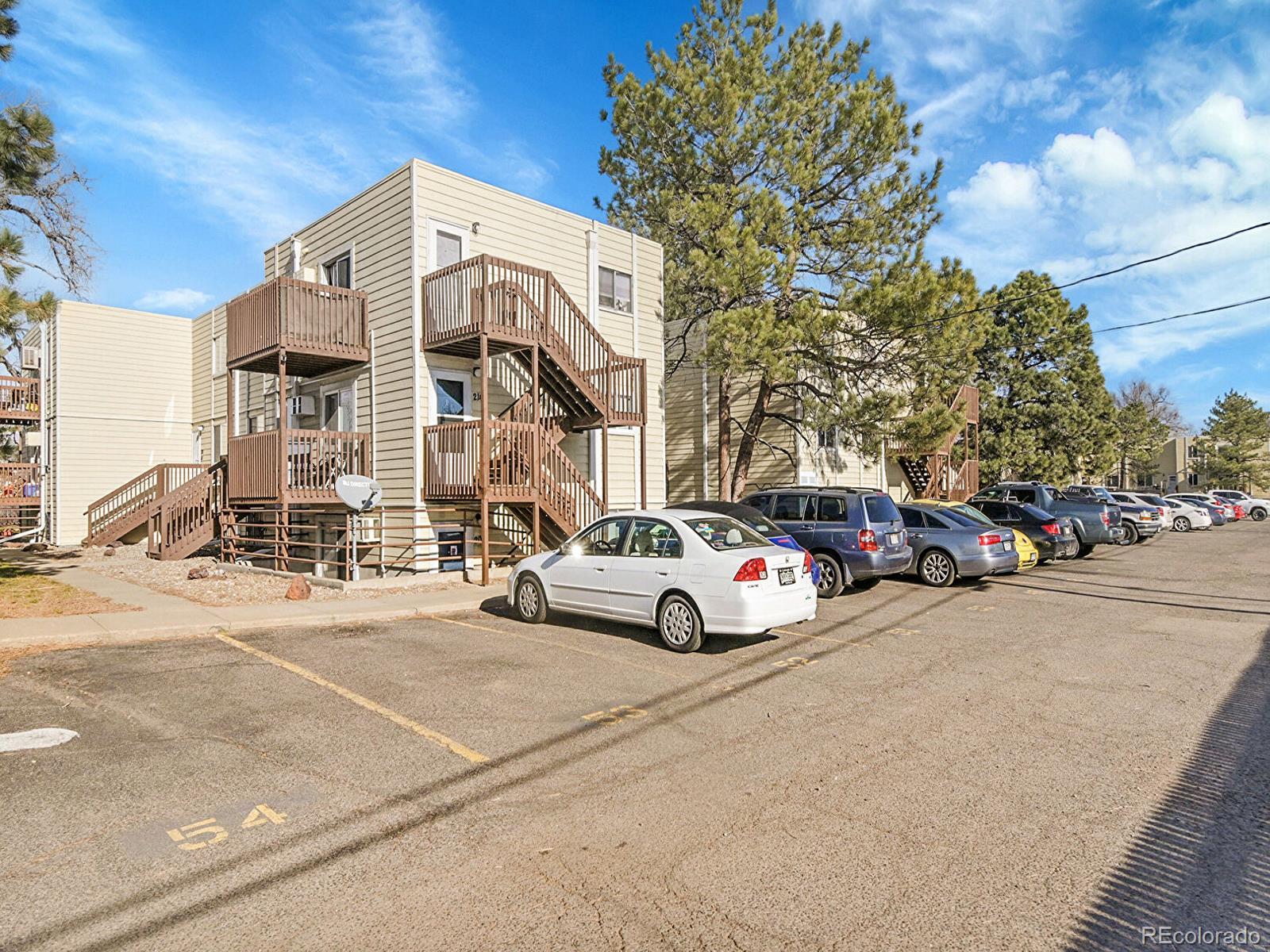 9340 West 49th Avenue, Unit 218 Wheat Ridge, CO 80033 - Photo 30 of 31 a view of street with parked cars