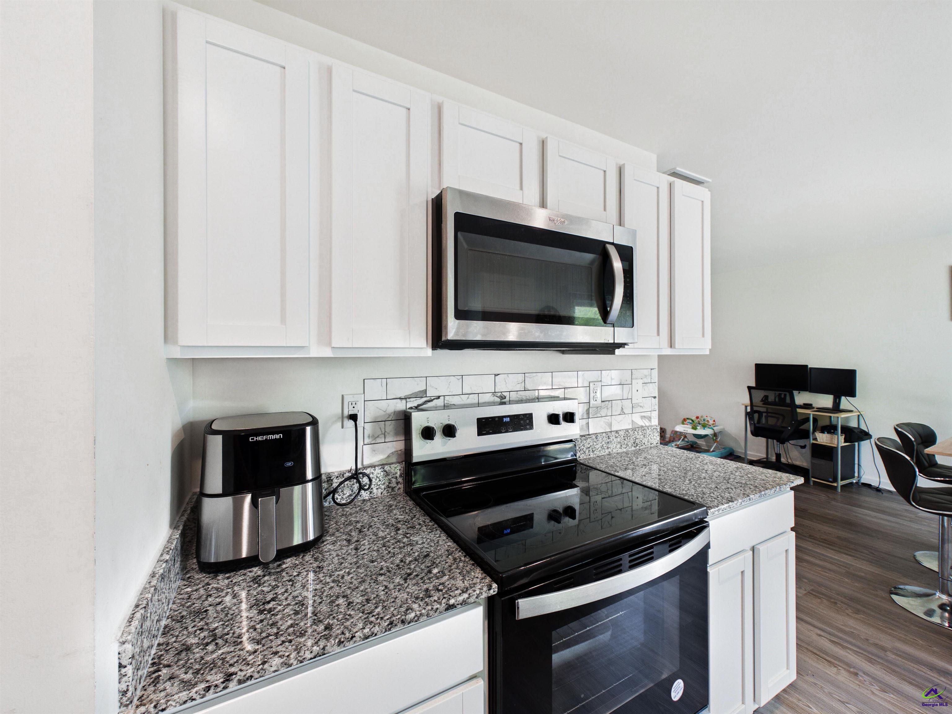 116 Jamie Court Fort Valley, GA 31030 - Photo 7 of 19 a kitchen with a stove and a microwave