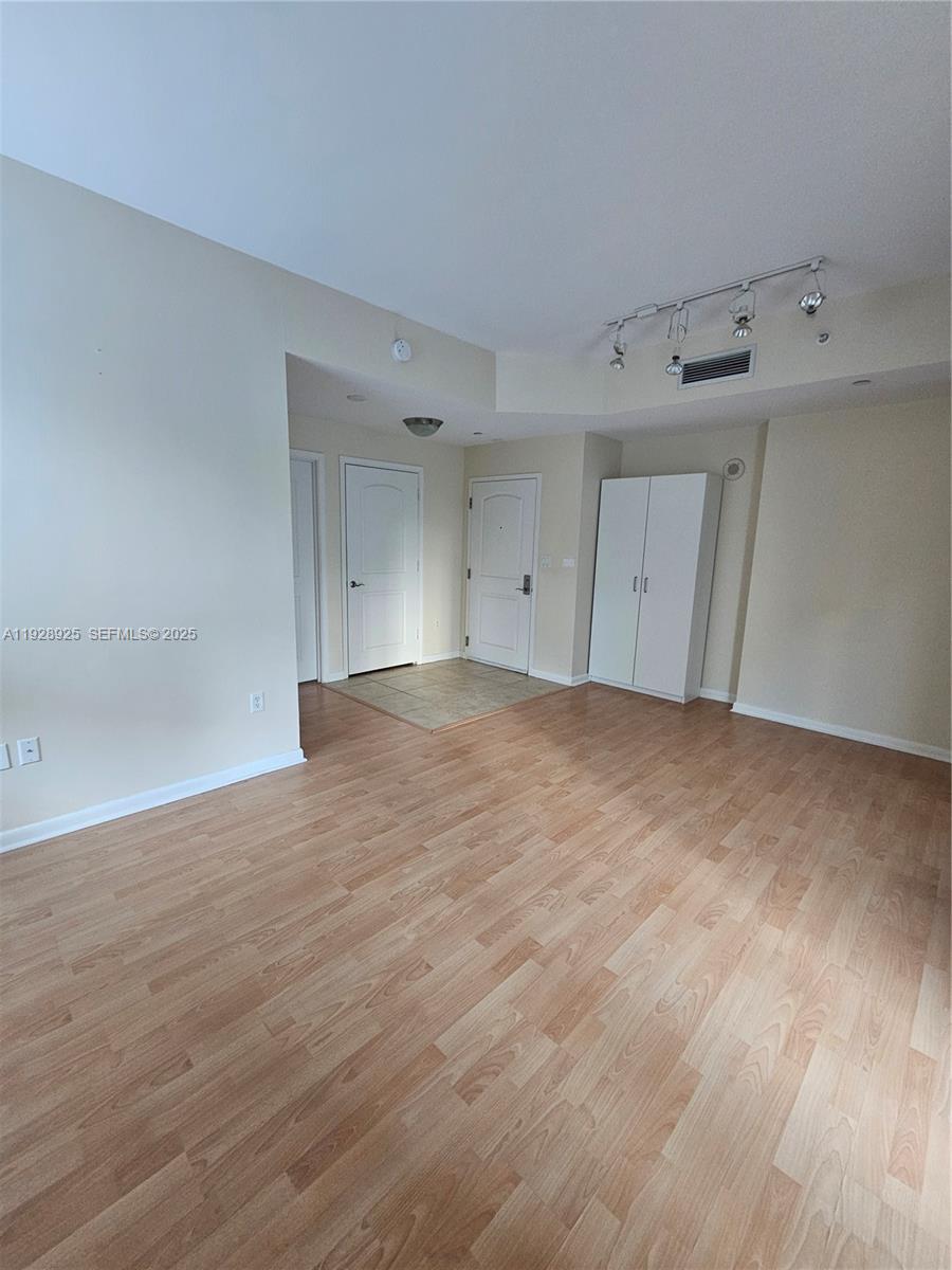 7350 Southwest 89th Street, Unit 315S Miami, FL 33156 - Photo 13 of 21 a view of empty room with wooden floor