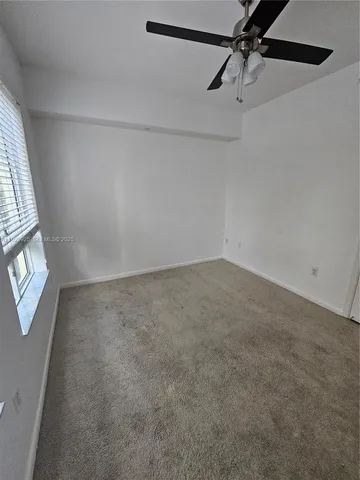 a view of a room with rack and fan