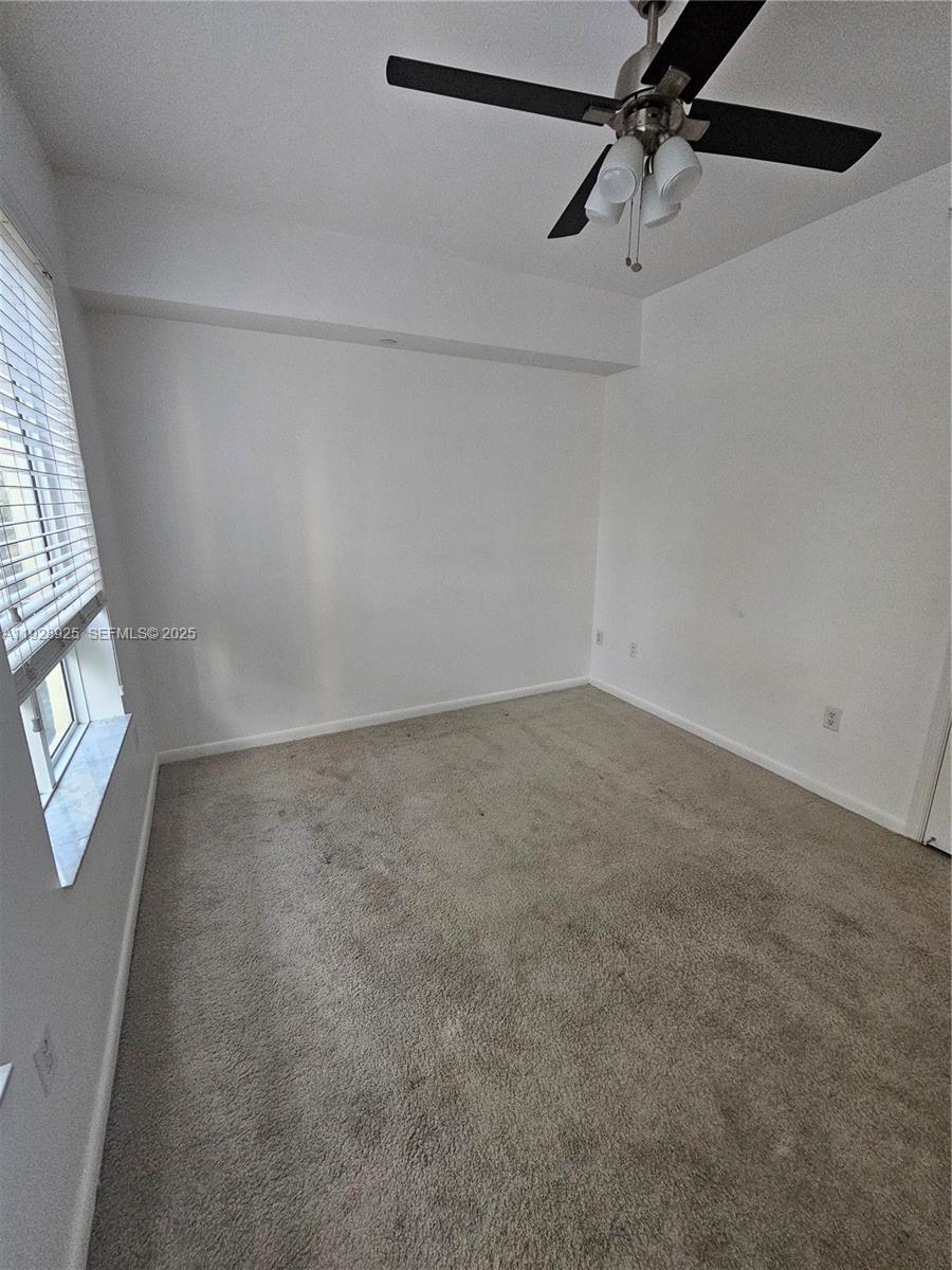 7350 Southwest 89th Street, Unit 315S Miami, FL 33156 - Photo 14 of 21 a view of a room with rack and fan