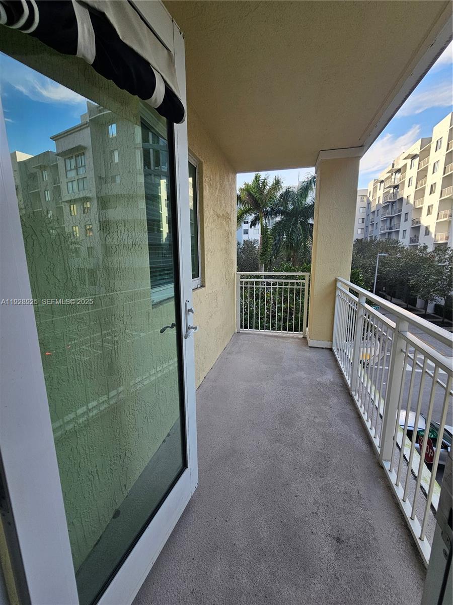 7350 Southwest 89th Street, Unit 315S Miami, FL 33156 - Photo 17 of 21 a view of a glass door and porch