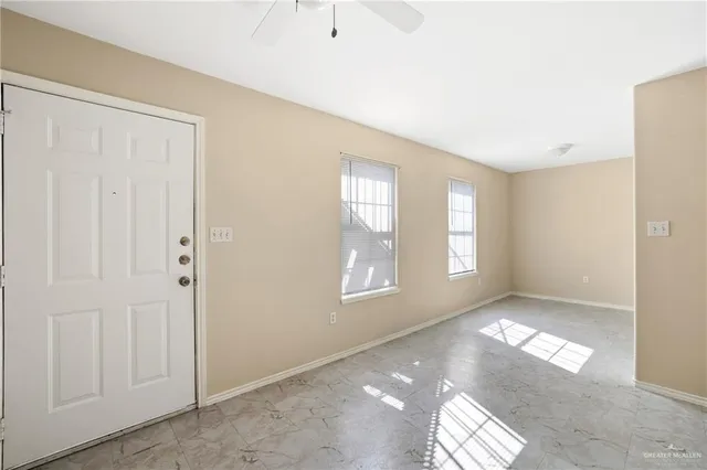 a view of empty room with windows