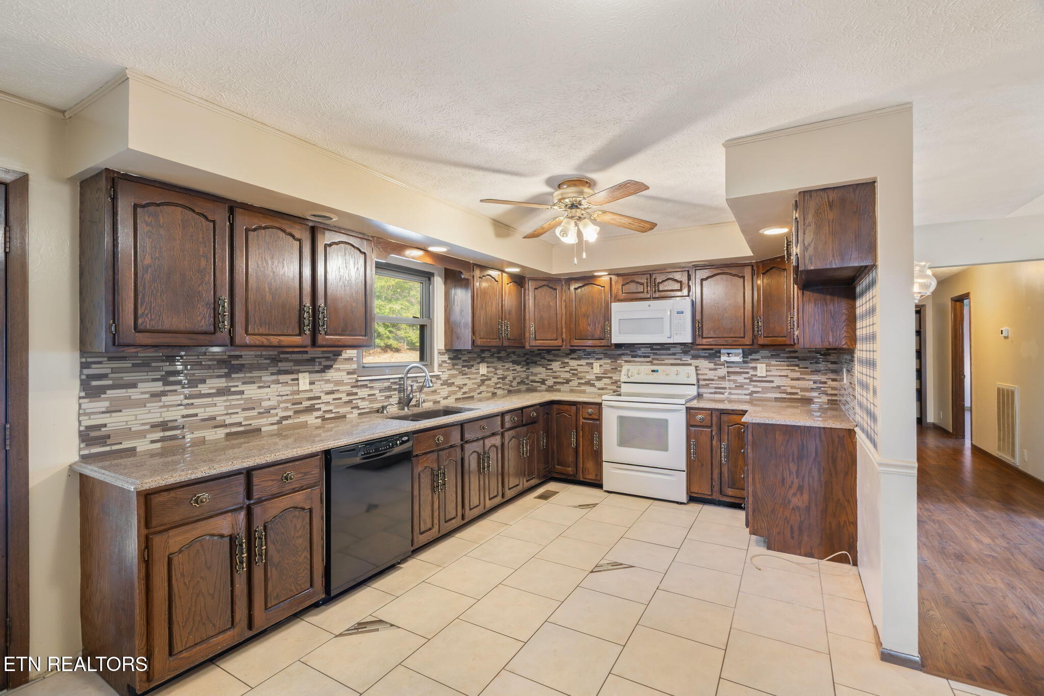115 Jamie Street Maynardville, TN 37807 - Photo 12 of 58 a large kitchen with cabinets and stainless steel appliances