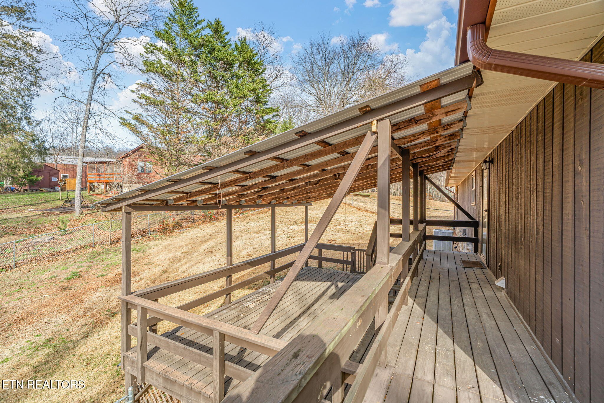 115 Jamie Street Maynardville, TN 37807 - Photo 33 of 58 a view of a balcony with wooden floor and outdoor space
