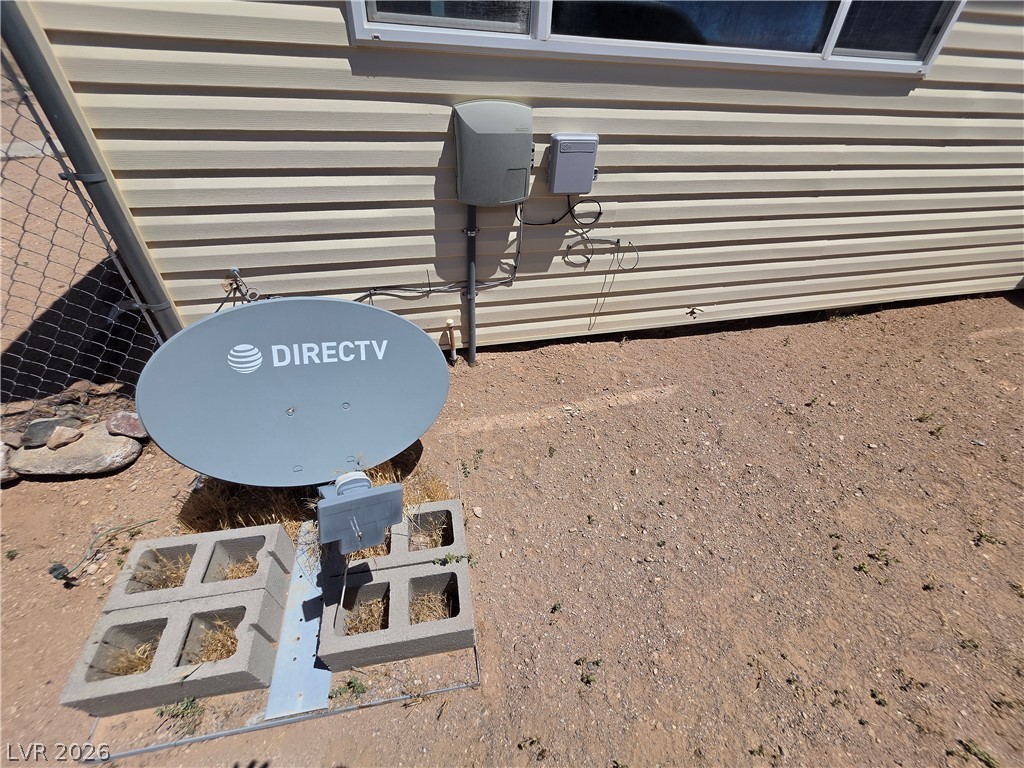 2930 Frehner Ranch Road Pioche, NV 89043 - Photo 6 of 39 Satellite dish installation against horizontal siding.