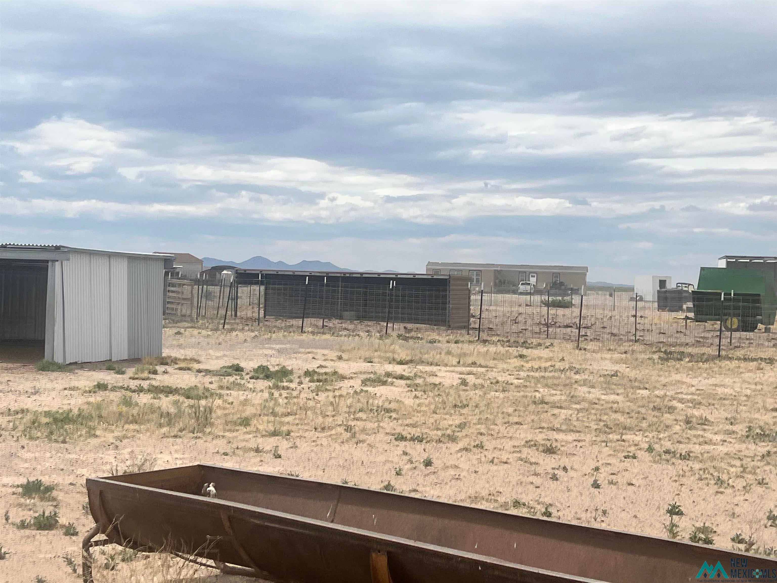 14006 Ciguena Road Southwest Deming, NM 88030 - Photo 30 of 49 View of yard featuring an outbuilding