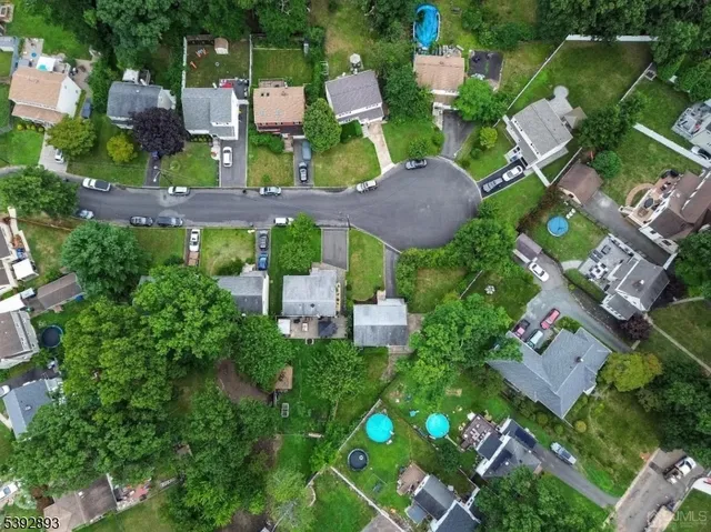 a spacious bedroom with a large bed and a large mirror