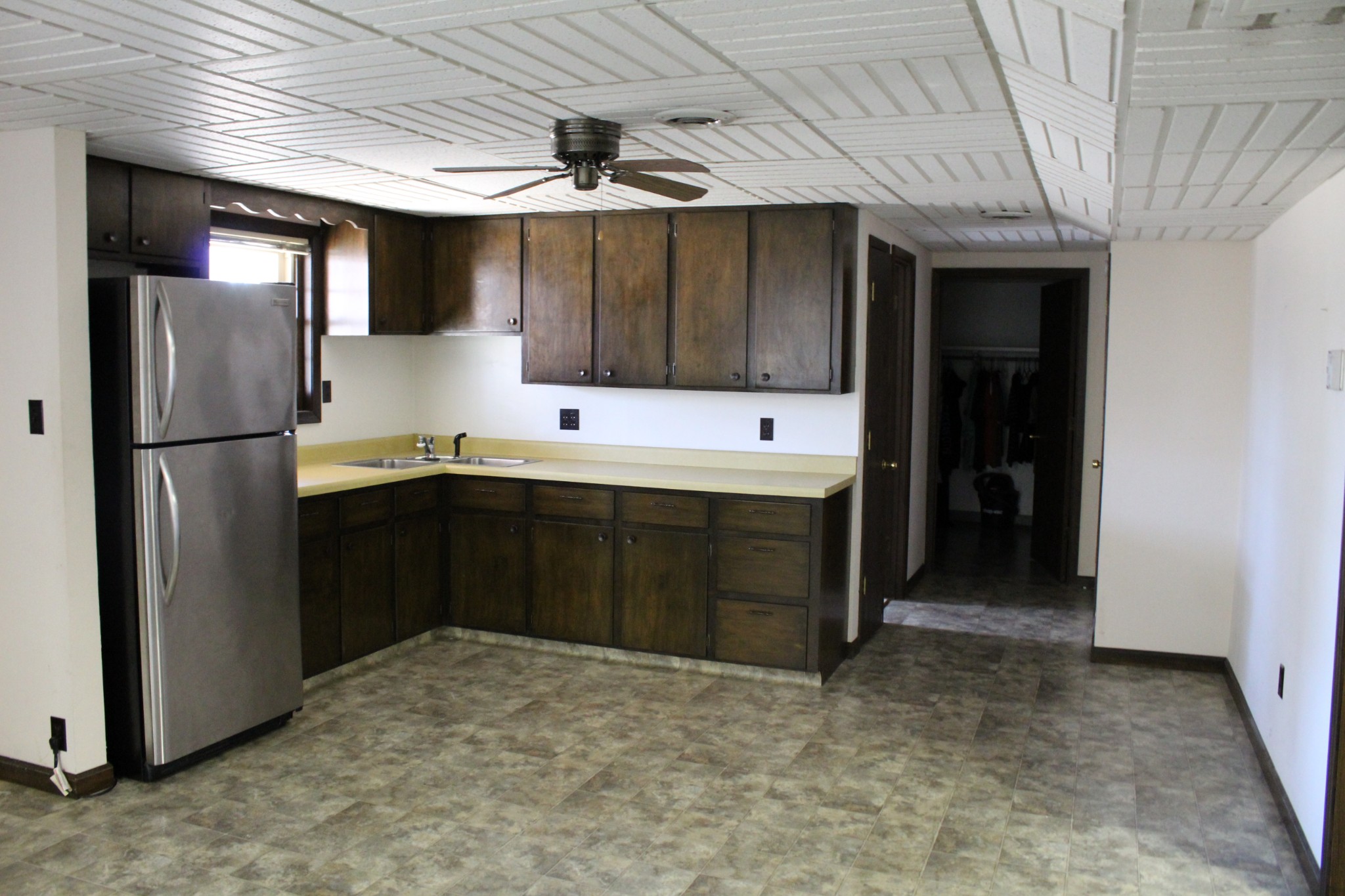 4165 Buckeye Road Cumberland City, TN 37050 - Photo 14 of 20 a kitchen with stainless steel appliances a refrigerator and a sink
