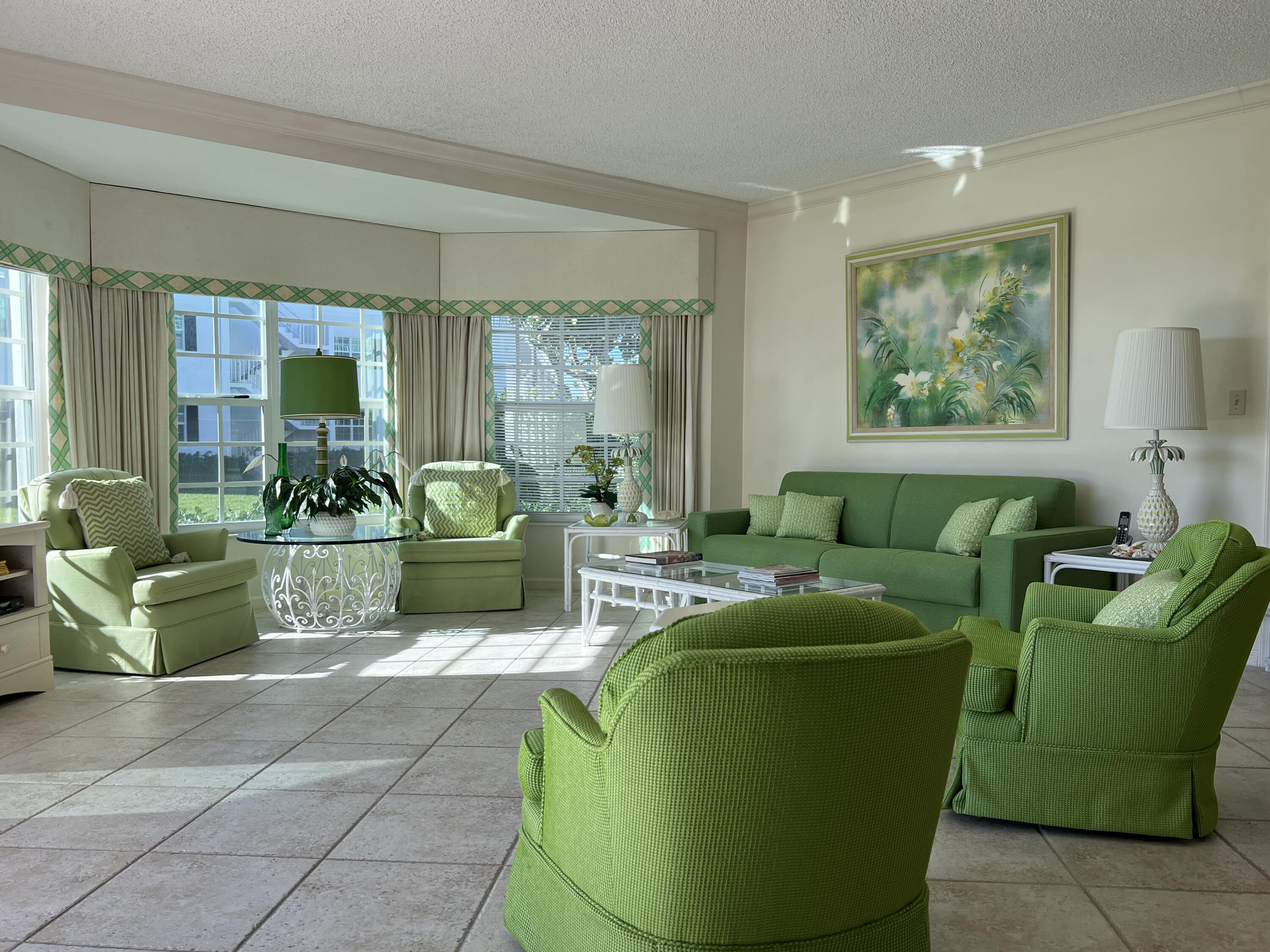 400 South Ocean Boulevard, Unit 103A Lake Worth, FL 33462 - Photo 3 of 12 a living room with furniture and a large window