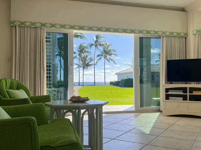 a view of a livingroom with furniture and a flat screen tv