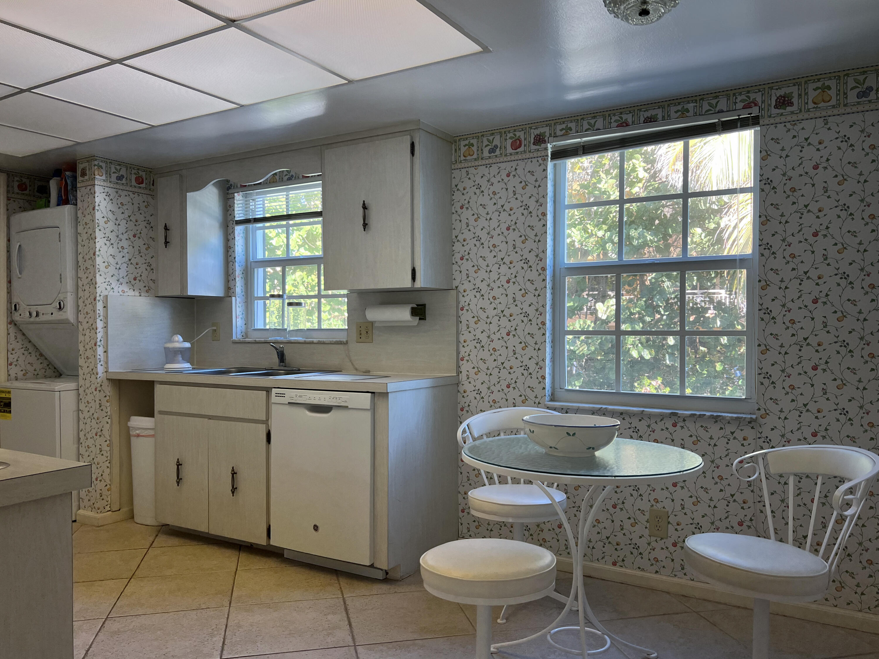 400 South Ocean Boulevard, Unit 103A Lake Worth, FL 33462 - Photo 7 of 12 a bathroom with a granite countertop toilet sink and mirror