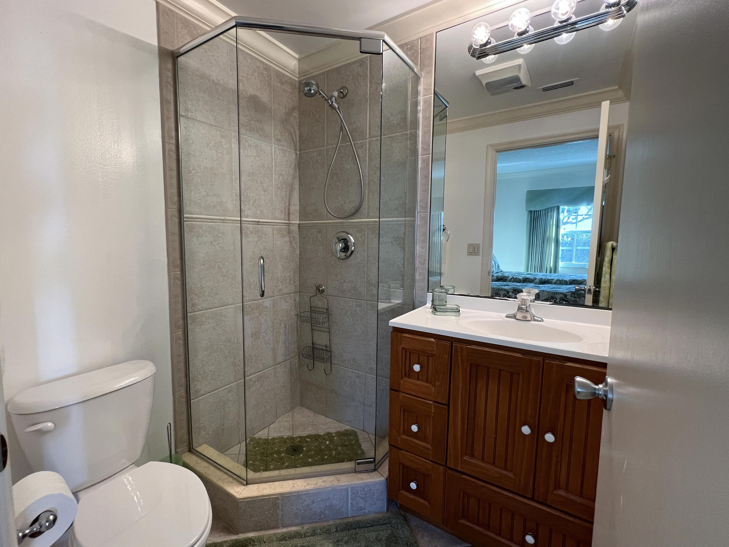 400 South Ocean Boulevard, Unit 103A Lake Worth, FL 33462 - Photo 10 of 12 a bathroom with a sink toilet and shower