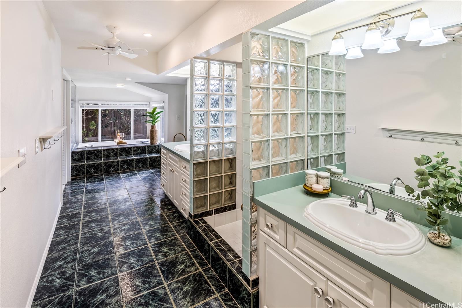 141 Kailuana Loop Kailua, HI 96734 - Photo 19 of 25 The main primary suite features double vanities and a walk-in shower