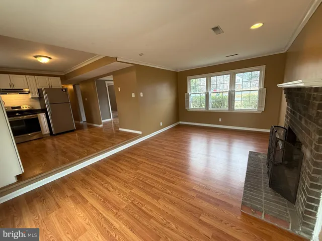 a view of a kitchen with a sink and a stove top oven