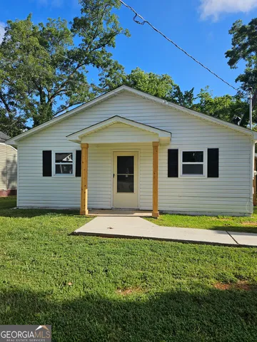 a backyard of a house with lots of green space