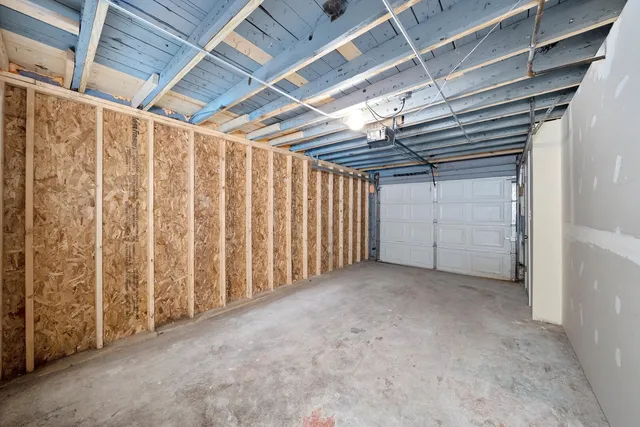 a view of empty room with wooden walls