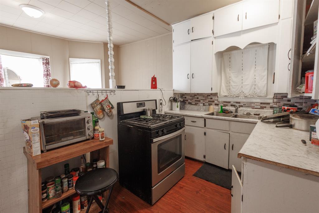 2202 Chester Street Sweetwater, TX 79556 - Photo 13 of 21 a kitchen with a stove and a sink