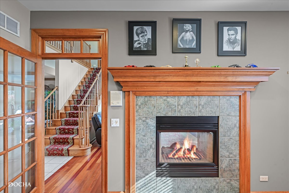 1107 Tuthill Road Naperville, IL 60563 - Photo 19 of 59 a view of living room with furniture and a fireplace