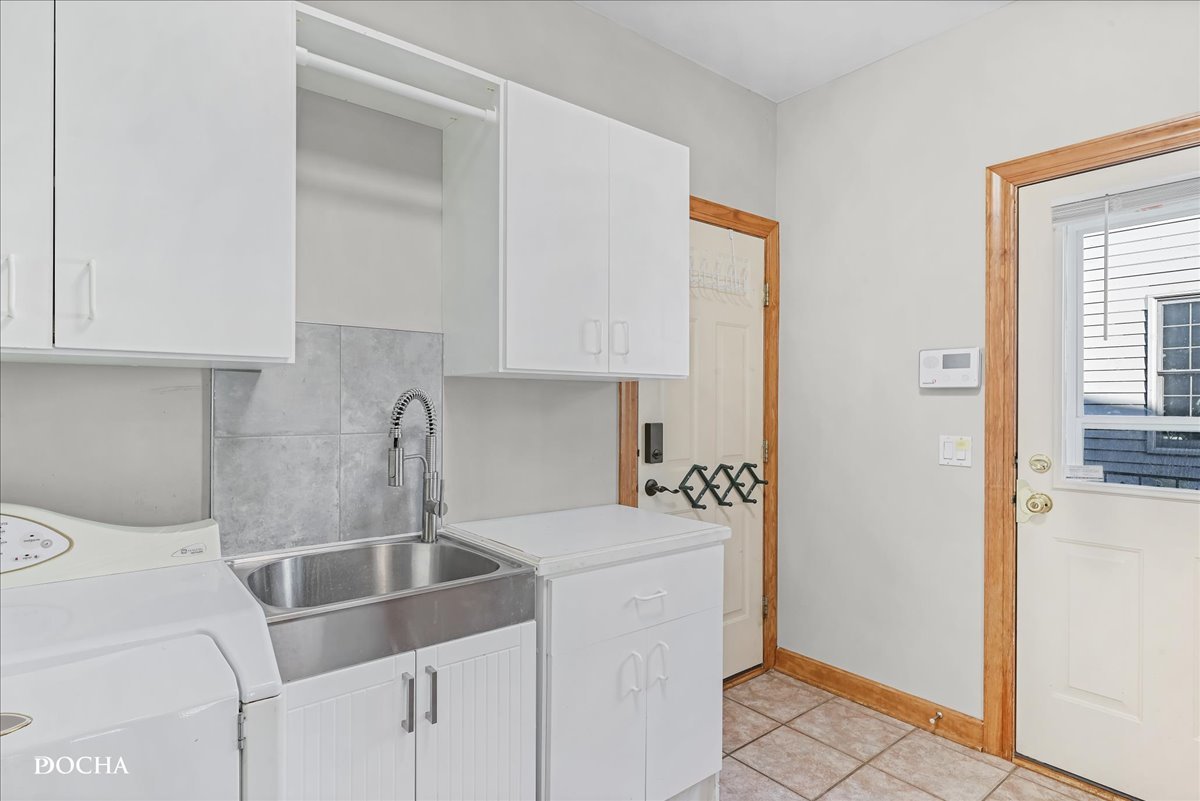 1107 Tuthill Road Naperville, IL 60563 - Photo 22 of 59 a kitchen with a sink cabinets and a window