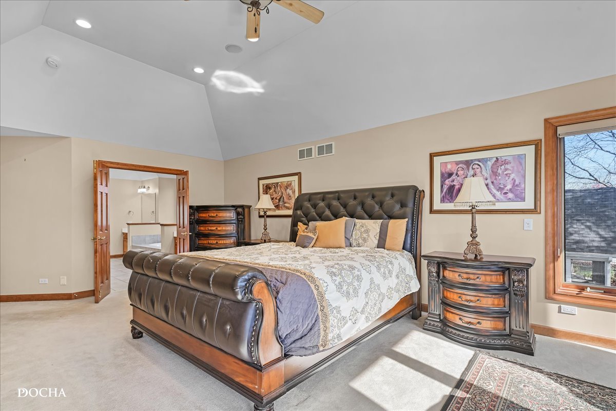 1107 Tuthill Road Naperville, IL 60563 - Photo 24 of 59 a bedroom with a bed a painting on the wall and a window