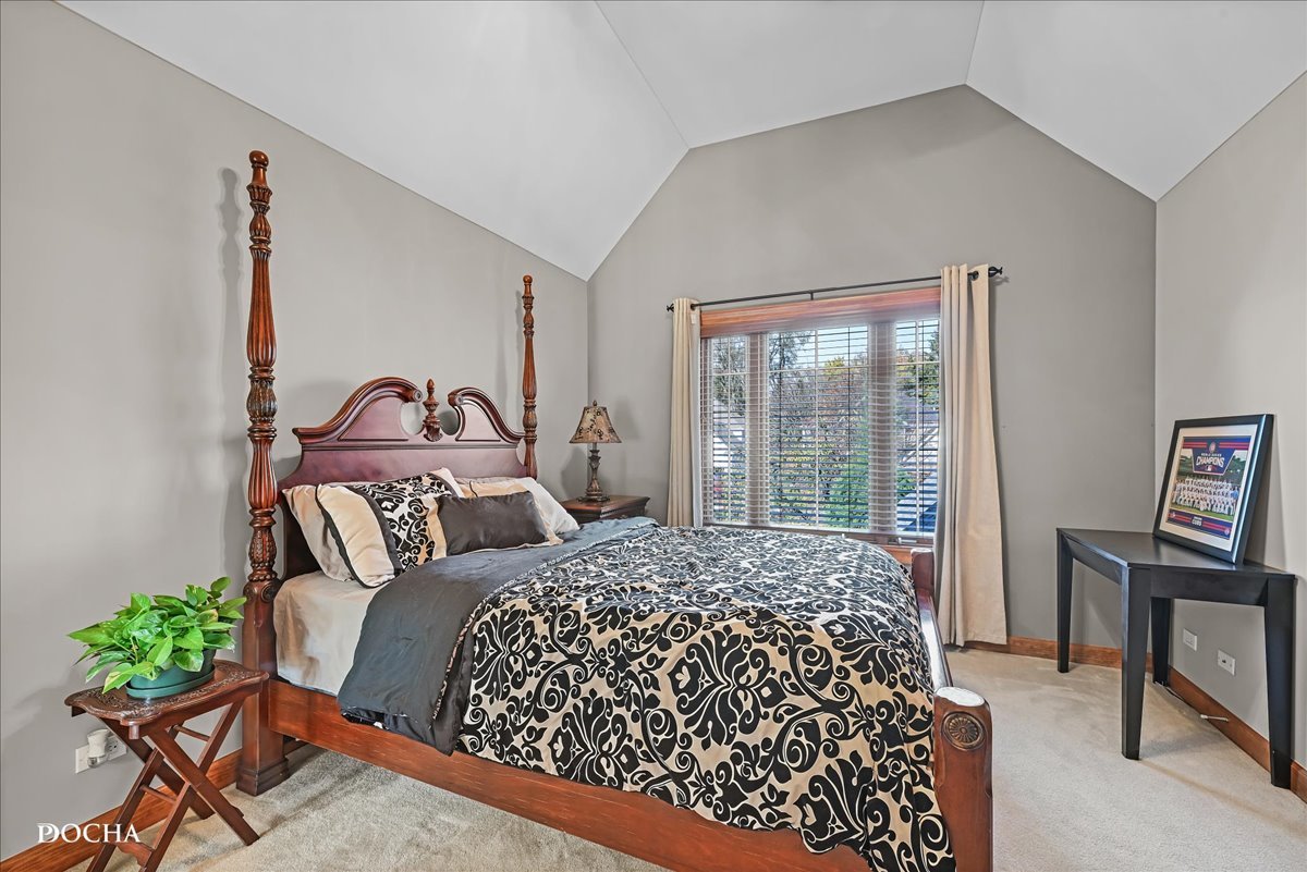 1107 Tuthill Road Naperville, IL 60563 - Photo 33 of 59 a bedroom with a bed and a chair