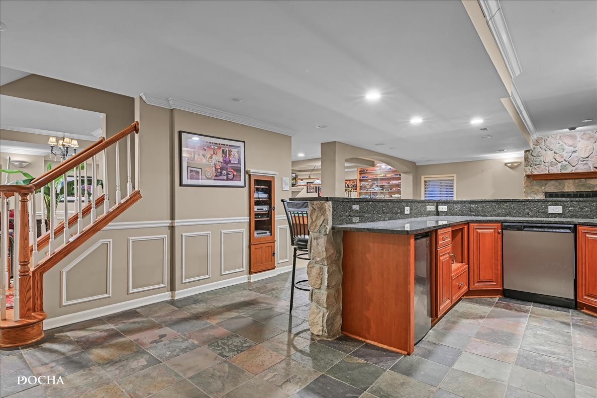 1107 Tuthill Road Naperville, IL 60563 - Photo 39 of 59 a kitchen with stainless steel appliances granite countertop a refrigerator and a stove top oven